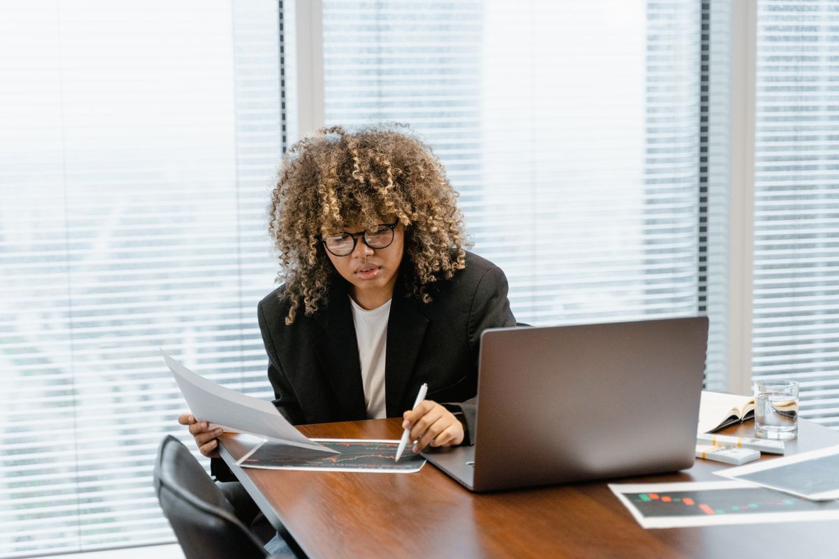 Sales manager reviewing opportunity pipeline reports against a customer relationship management application