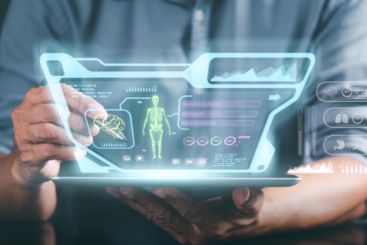 Doctors reviewing electronic medical records on tablets