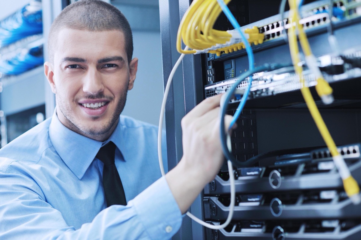 IT engineer working in a data centre server room