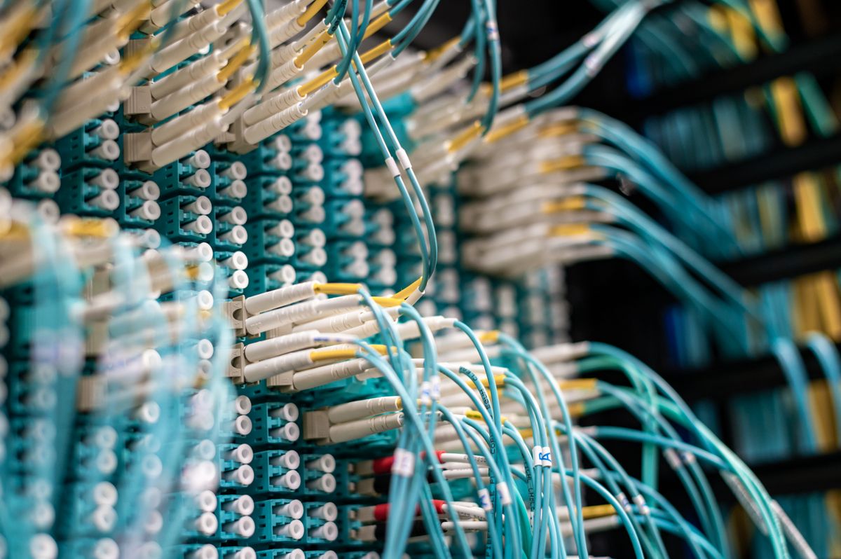 Network patch panel with colour-coded fibre runs terminating into a core switch